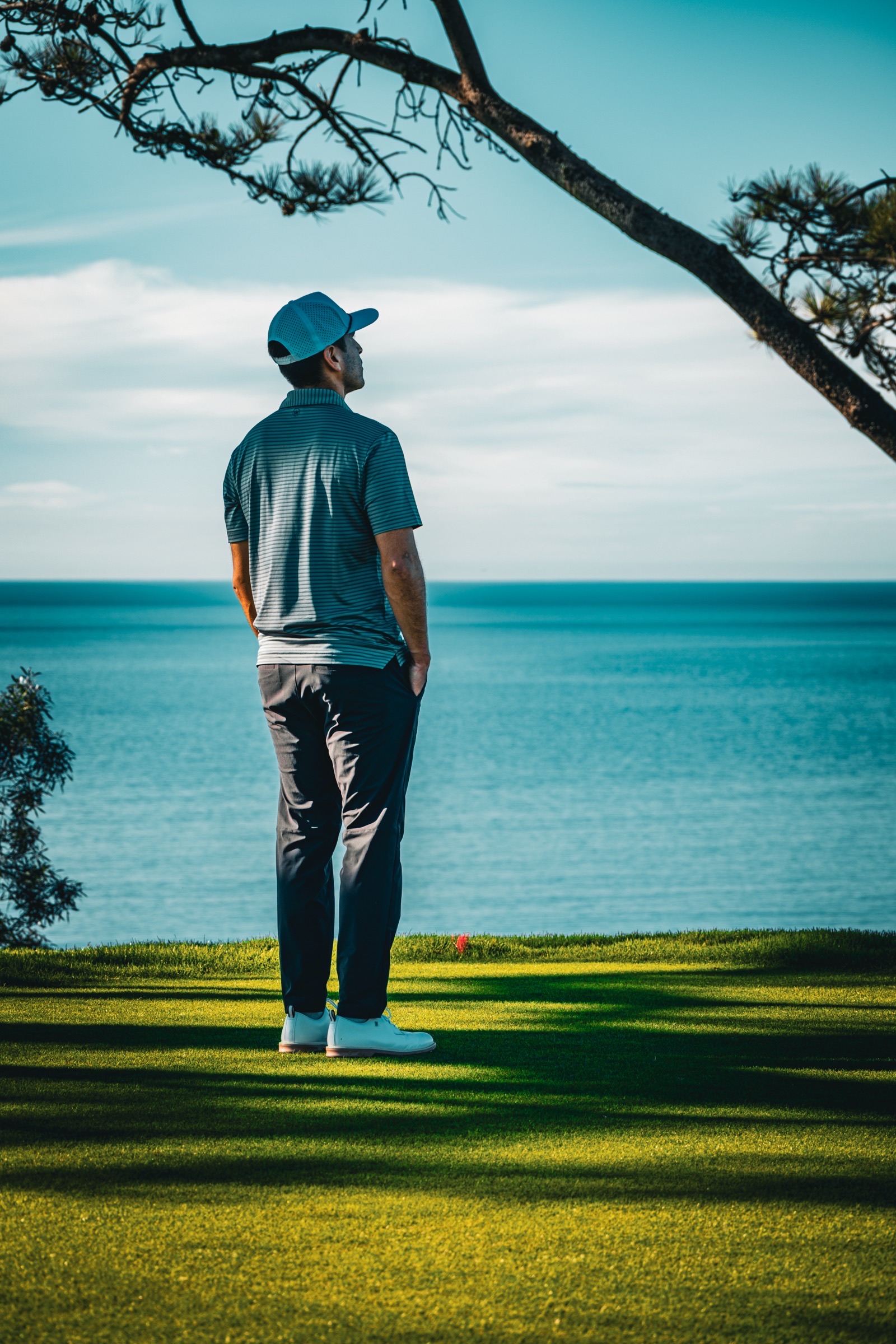 Golfer overlooking the ocean